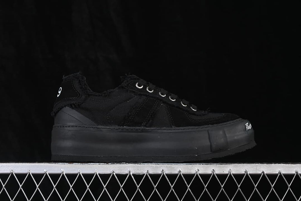 Side profile showing the layered upper and thick platform sole
