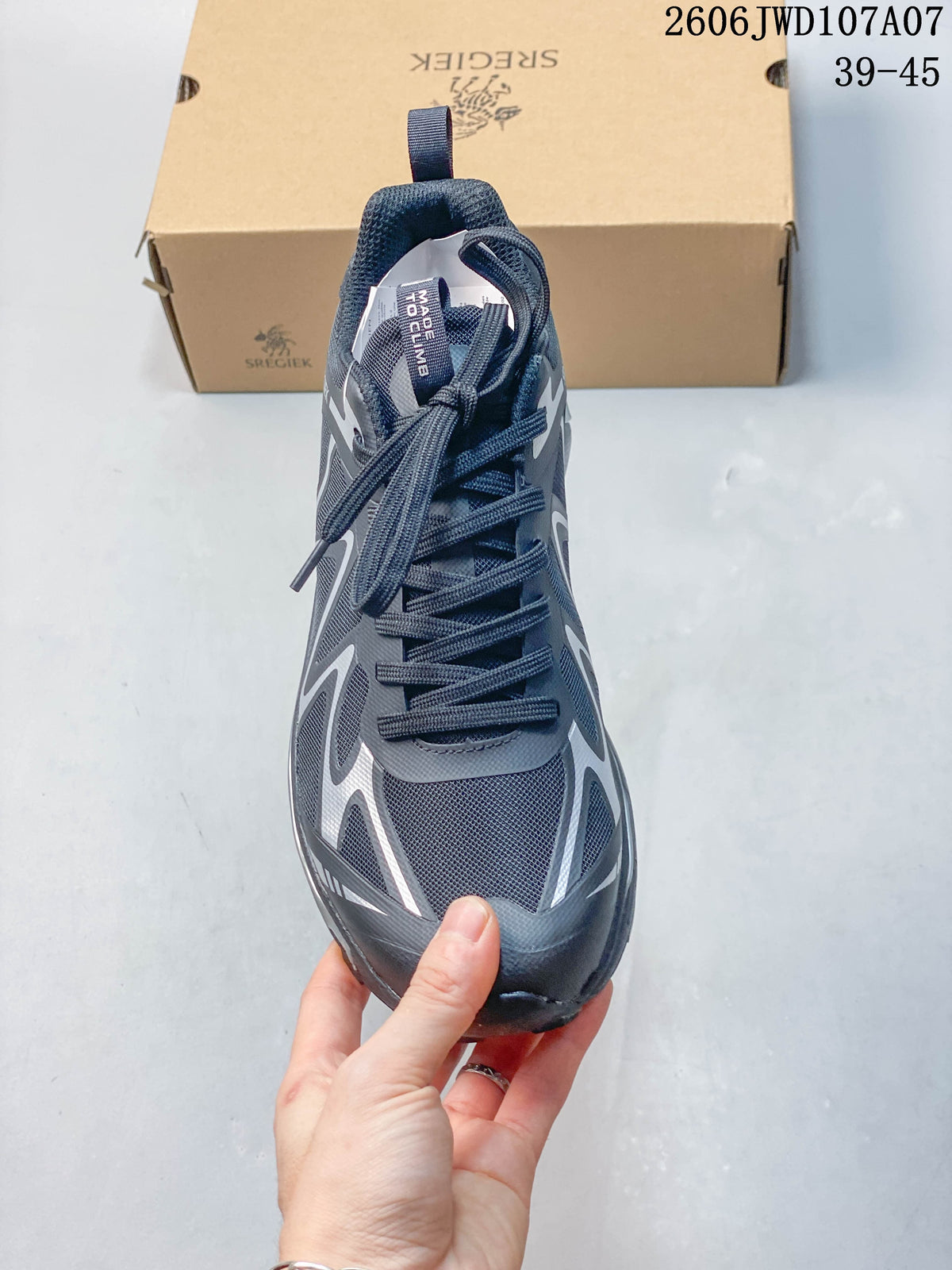 Front view of a Sregiek hiking shoe showing its laces and mesh-like upper