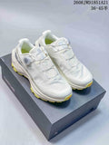 Pair of white Kailas FUGA shoes with dial closures and bright yellow outsole accents