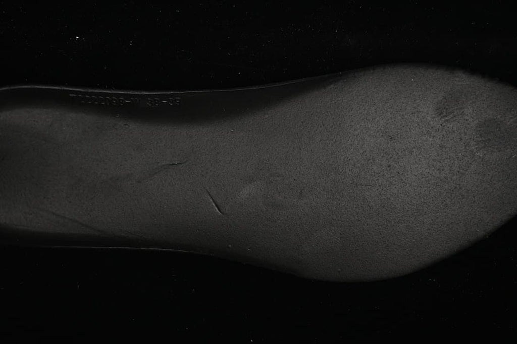 Close-up of the sneaker's dark outsole.