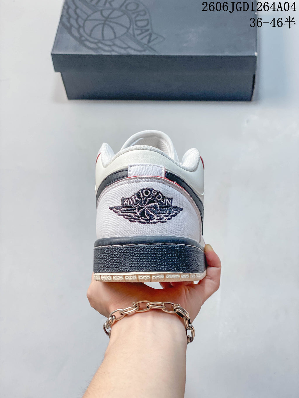 Heel view showing embroidered Wings logo and navy heel detail