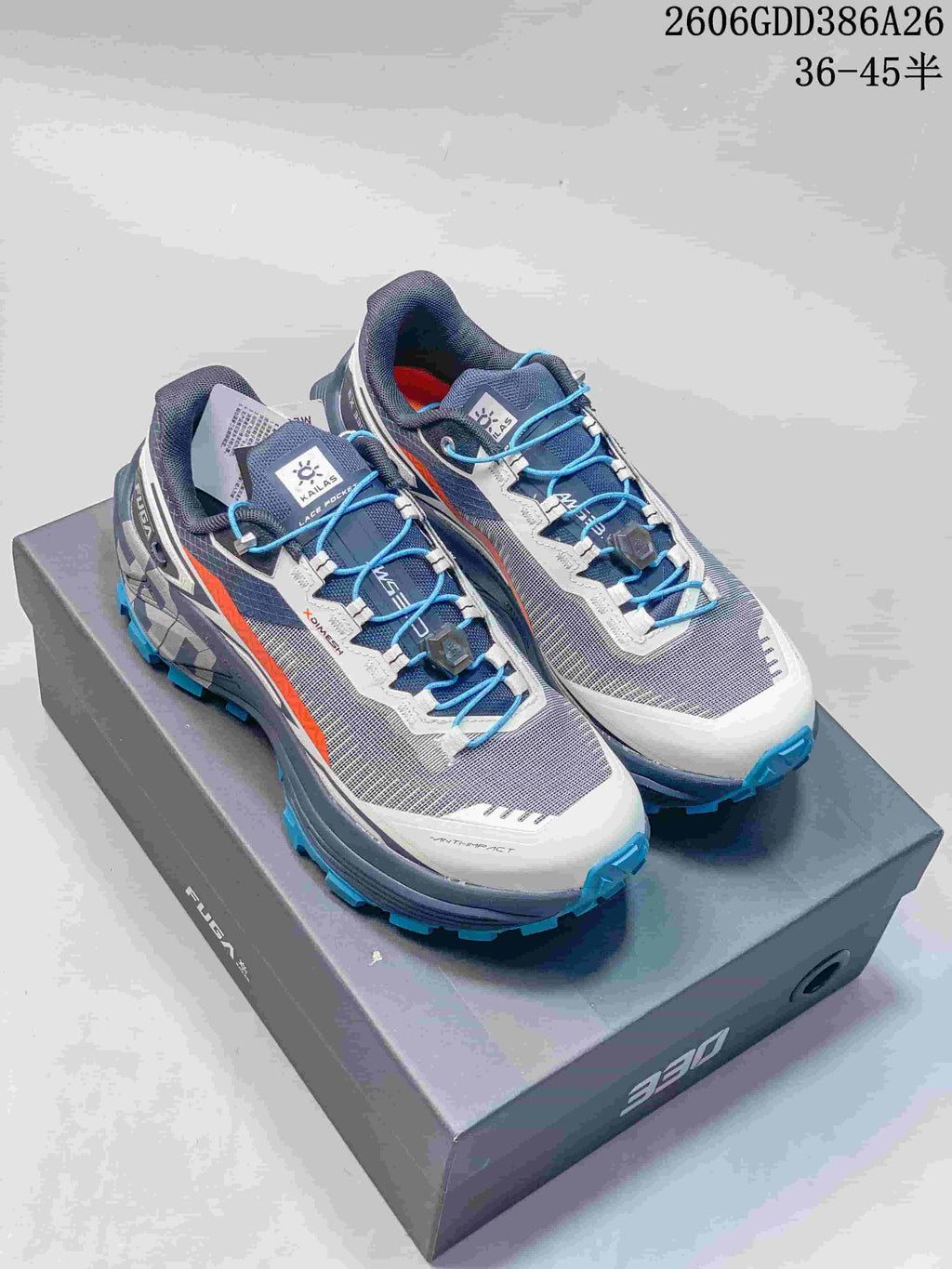 Gray and white KAILAS FUGA EX330 trail shoes with blue laces and turquoise outsole lugs
