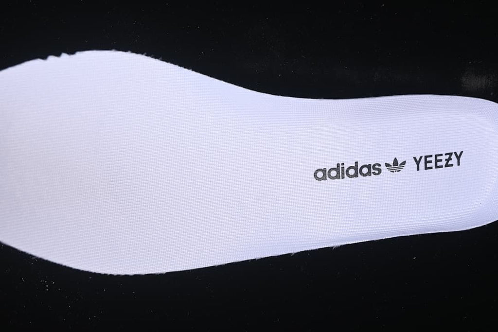 Removable insole with adidas and YEEZY text.