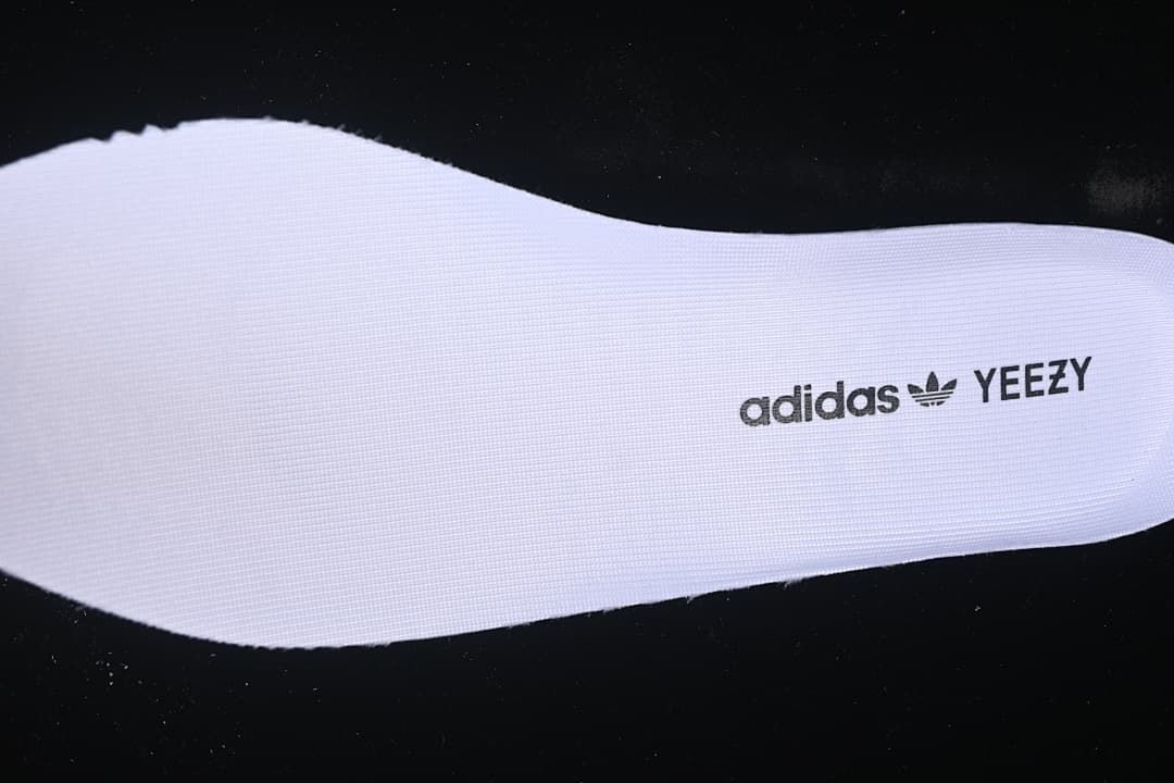 Removable insole with adidas and YEEZY text.