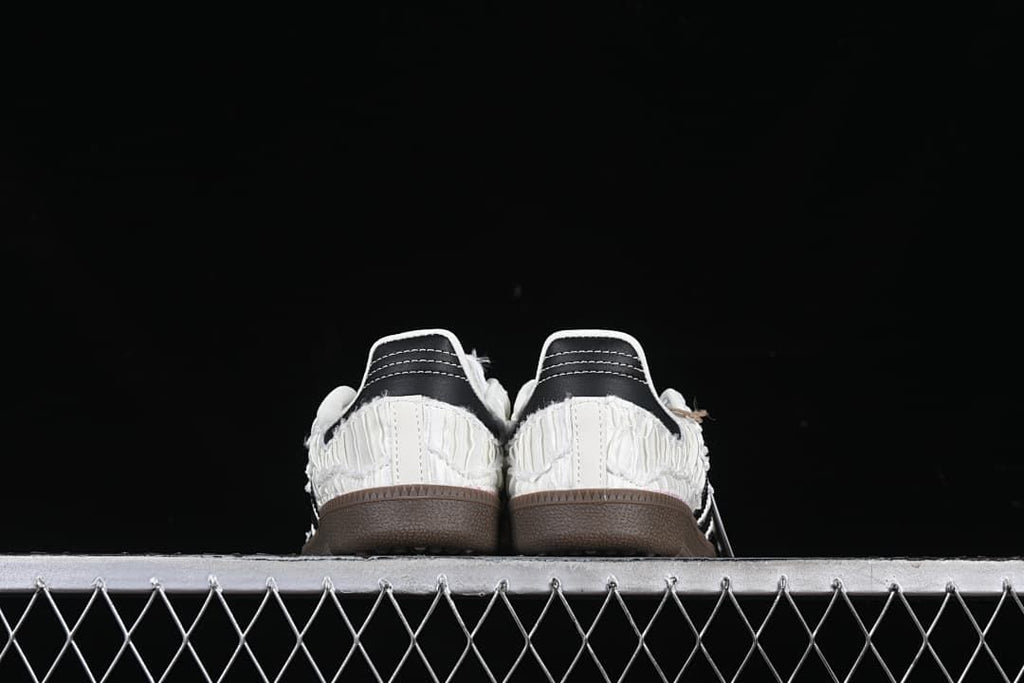 Rear view of both sneakers with black heel details