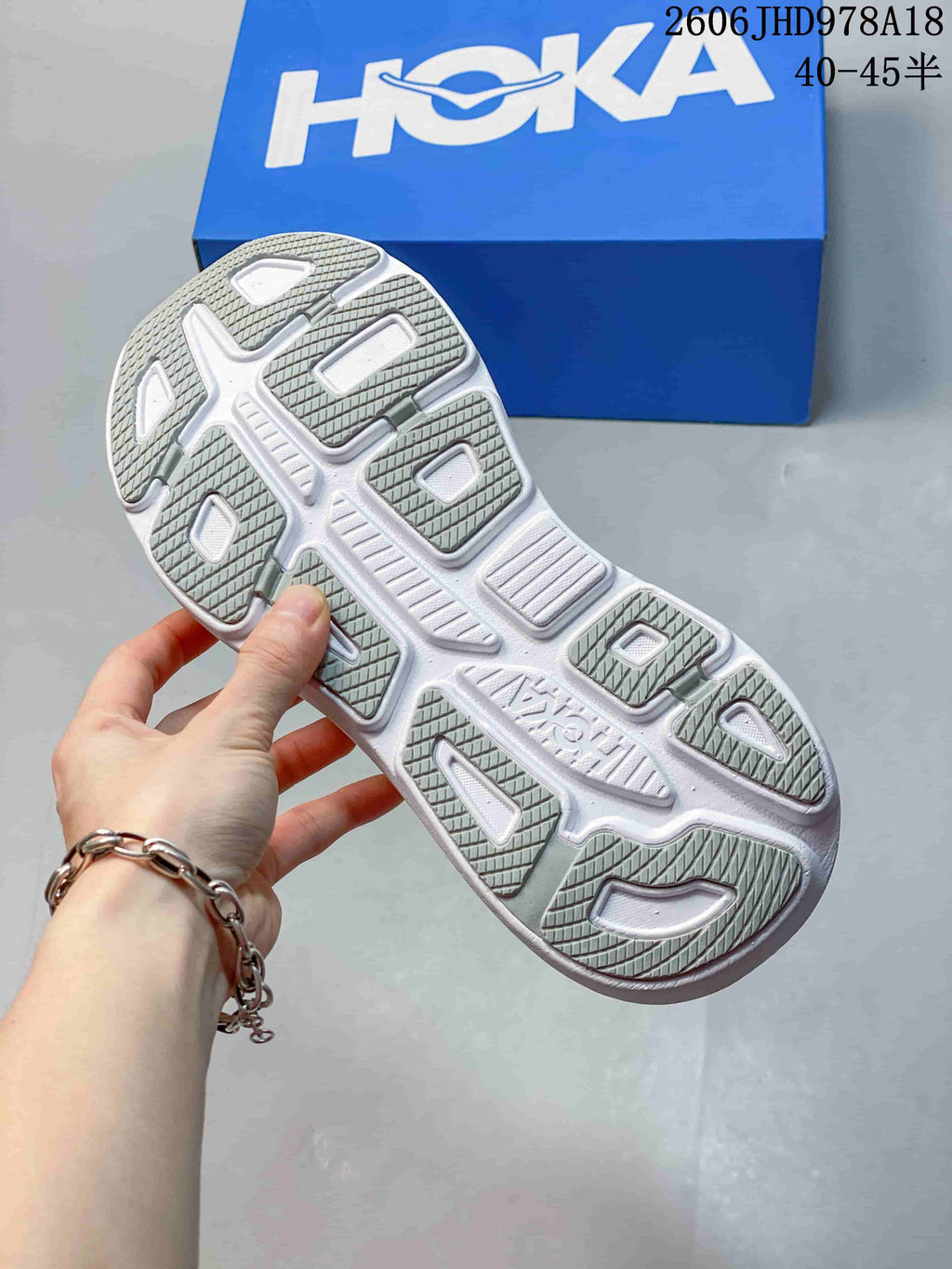 Outsole view of a HOKA Bondi 9 shoe, showing segmented tread
