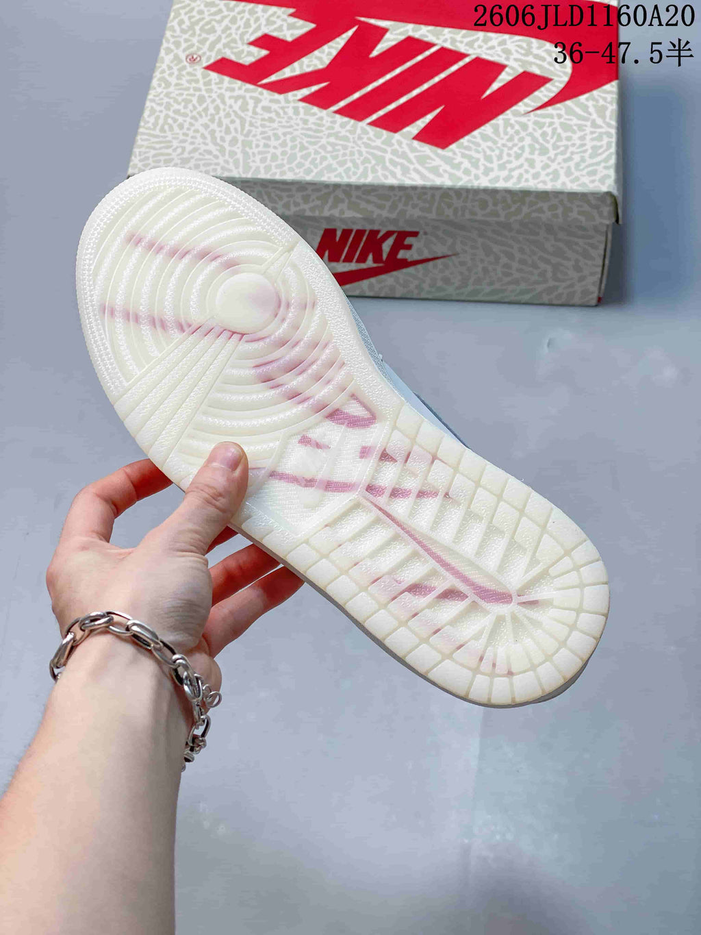 Close-up of the sneaker outsole and patterned shoebox