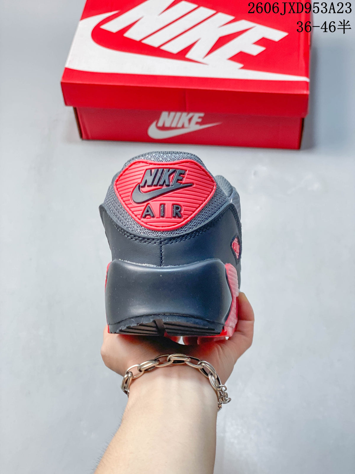 Rear view of a Nike Air Max 90 showing the heel branding and panels