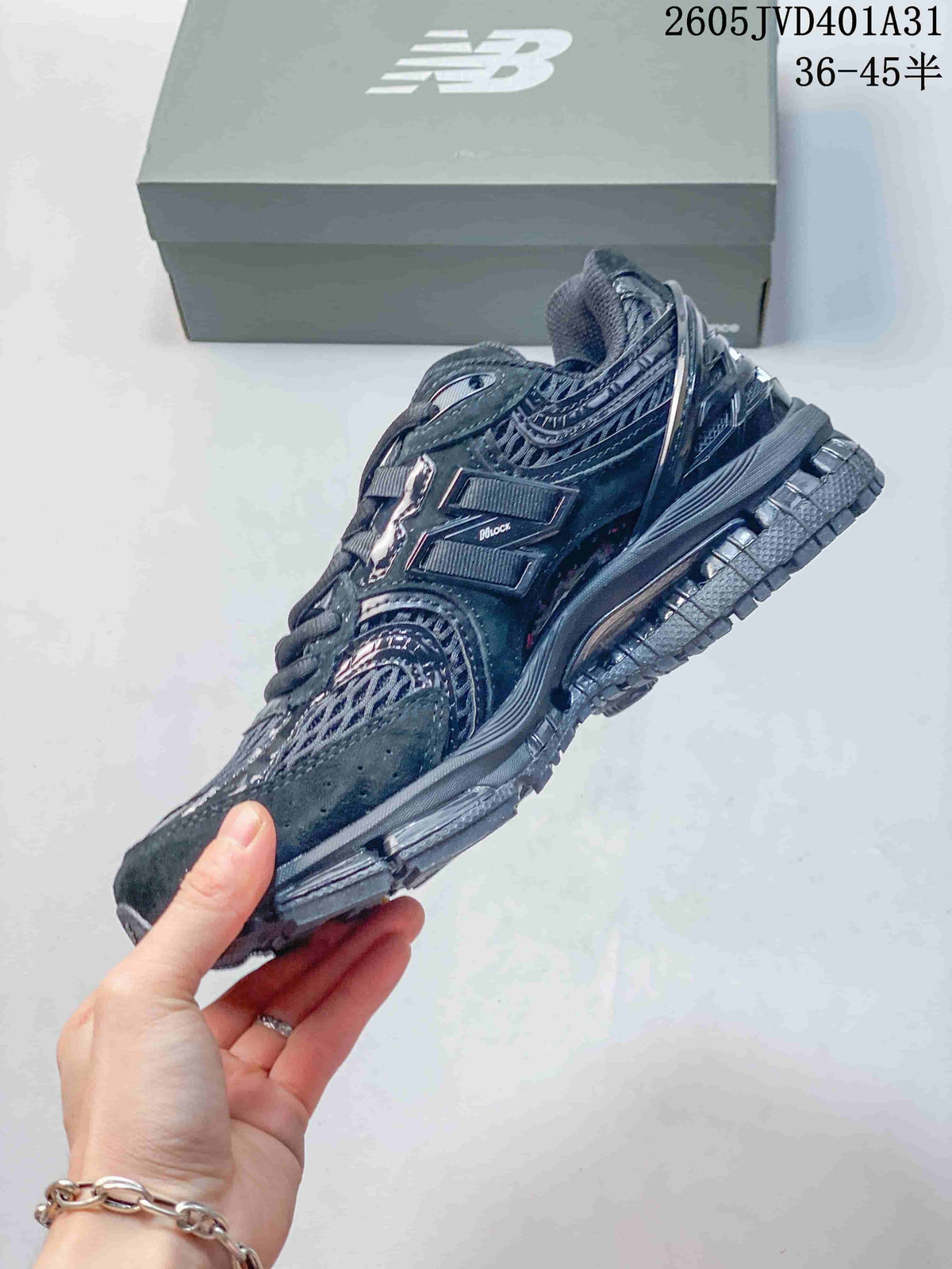 Side view of a charcoal gray New Balance sneaker with layered panels and a prominent N logo; size range text appears in the image.
