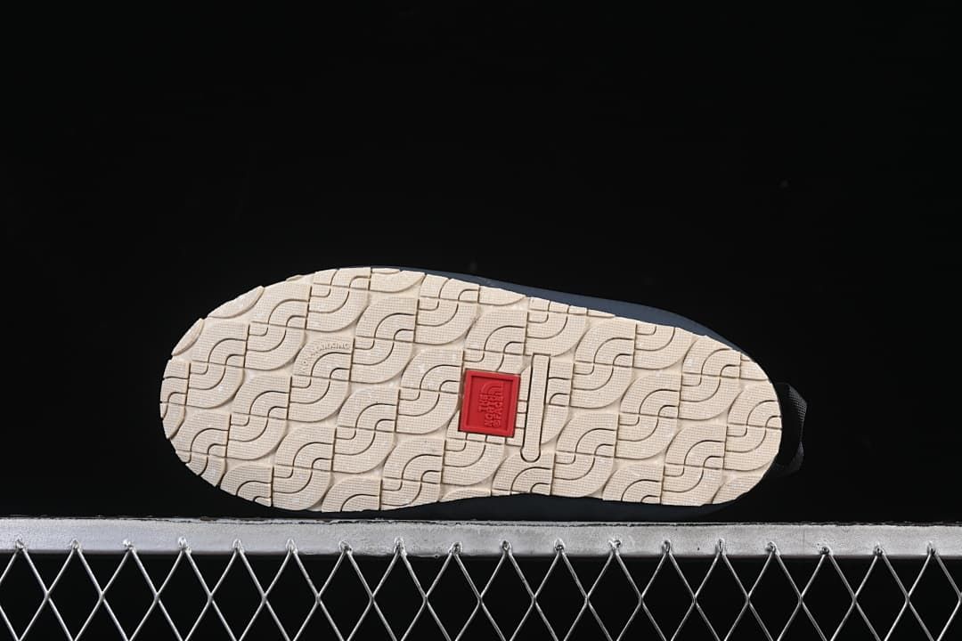 Underside view showing the patterned light-colored outsole