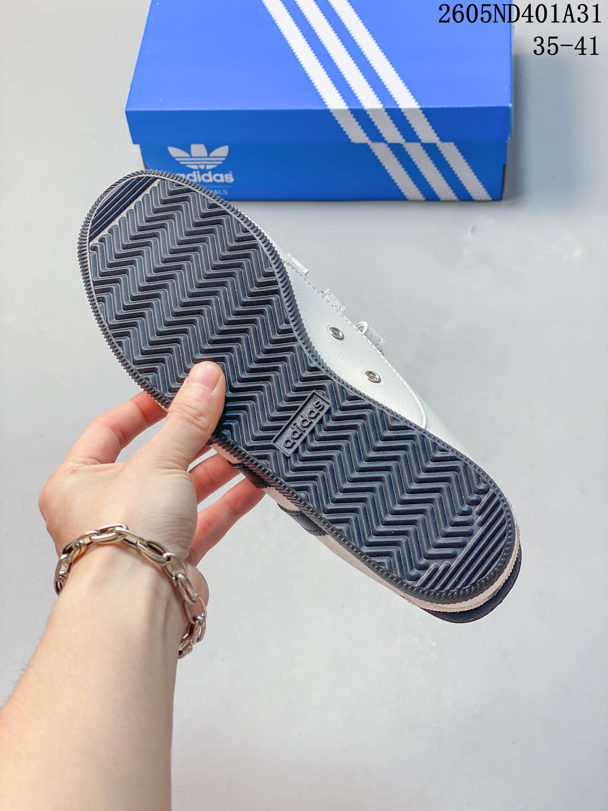 Underside of the sneaker showing a gray zigzag-pattern outsole.