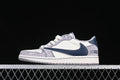 Side view of a light grey, off-white, and navy low-top sneaker