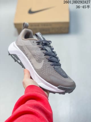 Gray Nike trail running shoe with a tonal Swoosh and white midsole.