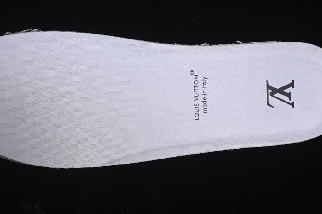 Close-up of the white insole with printed branding