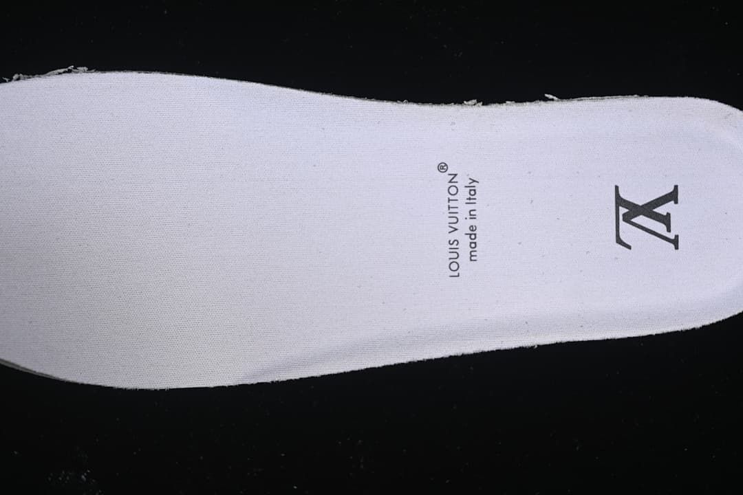 Close-up of the white insole with printed branding