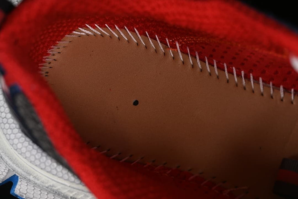 Close-up view inside the sneaker, showing red lining