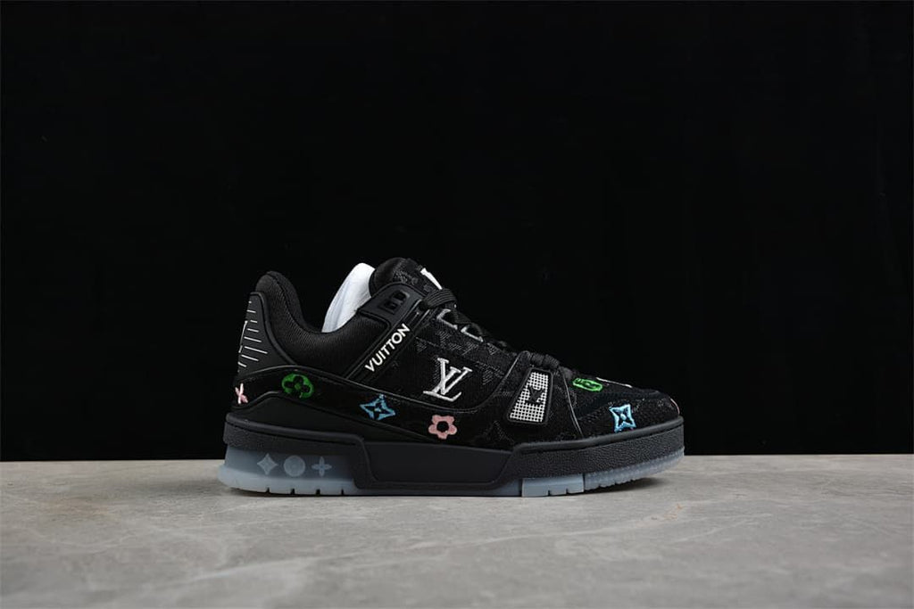 Side view highlighting the patterned upper, colorful motifs, and translucent outsole