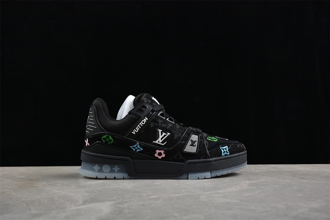 Side view highlighting the patterned upper, colorful motifs, and translucent outsole