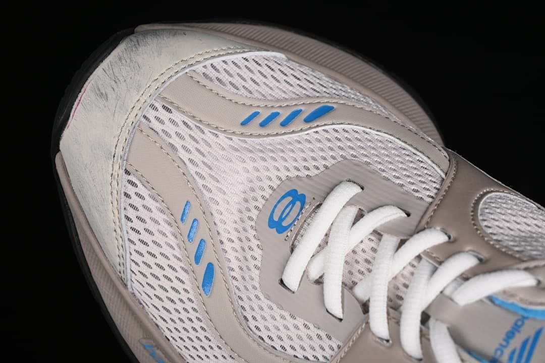 Close-up of the mesh toe and lace area with blue accents