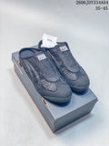Dark navy Onitsuka Tiger Mexico 66 Sabot shoes shown on a shoebox from above.