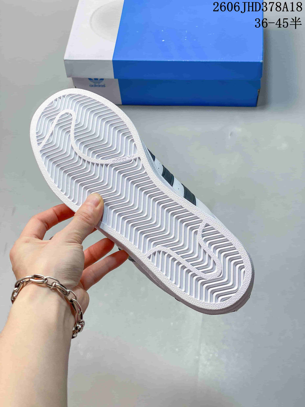 Underside of the sneaker showing a patterned outsole