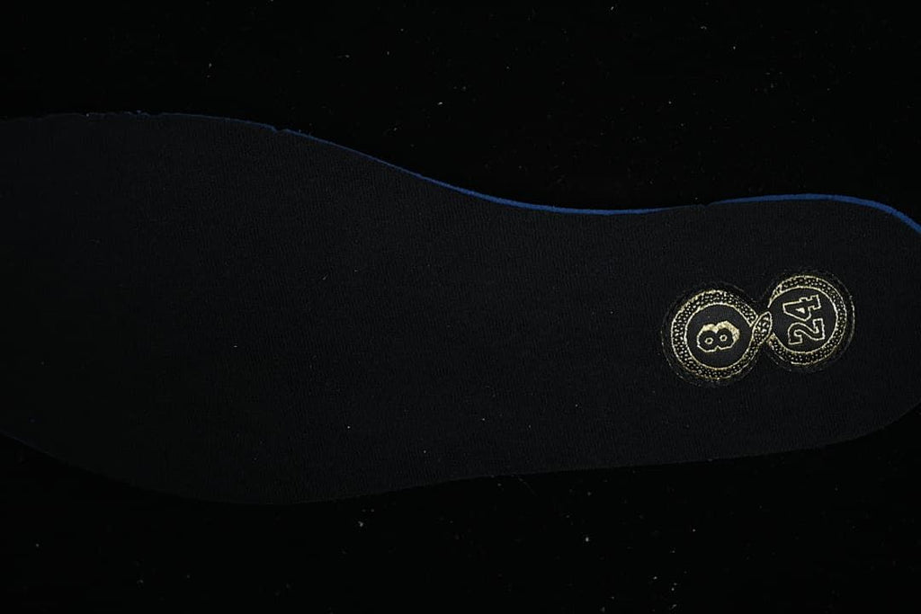 Black shoe insole with gold size markings
