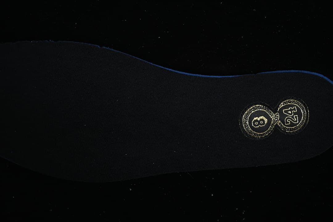 Black shoe insole with gold size markings