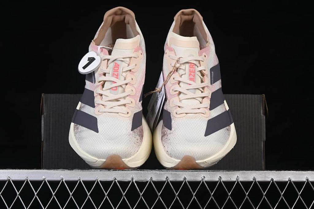 Front view of the pair showing the laces, patterned toe boxes and dark side stripes