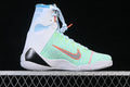 Side view of a high-top Nike Kobe basketball shoe with a bright multicolor upper and coral swoosh accent.