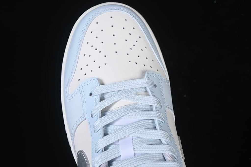 Top view of the perforated toe and light blue laces