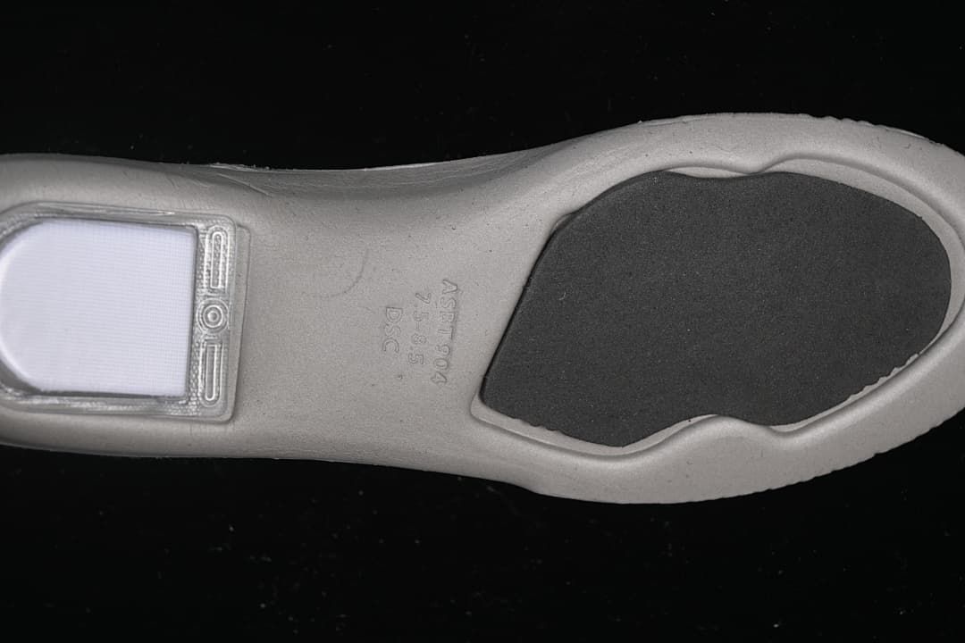Underside of the shoe insert showing its shaped footbed