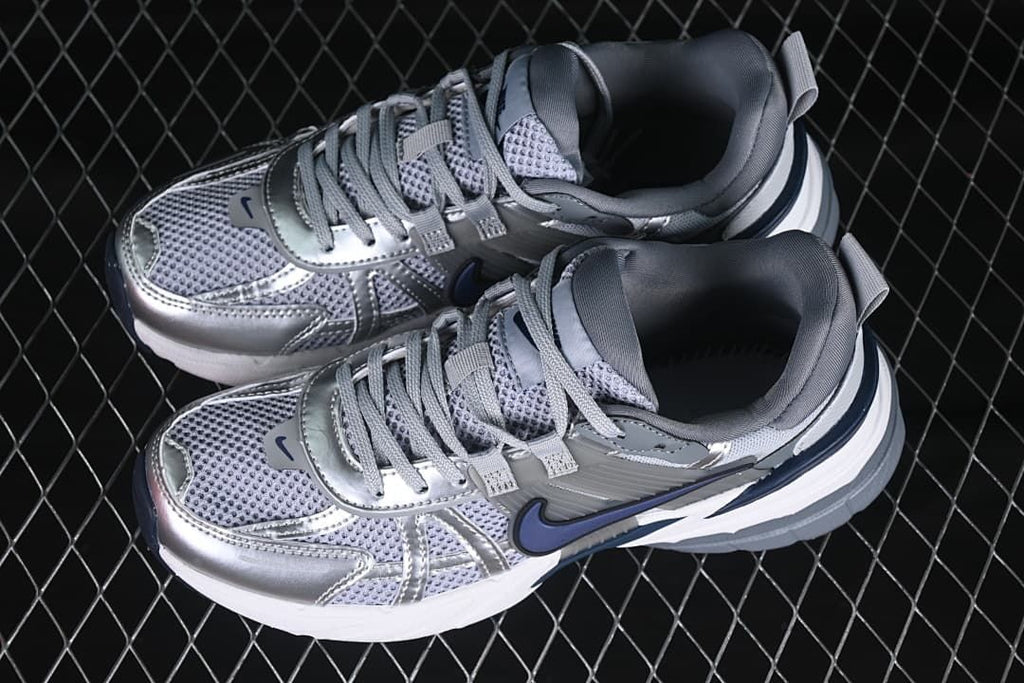 Pair of silver and gray Nike V2K Run sneakers viewed from above