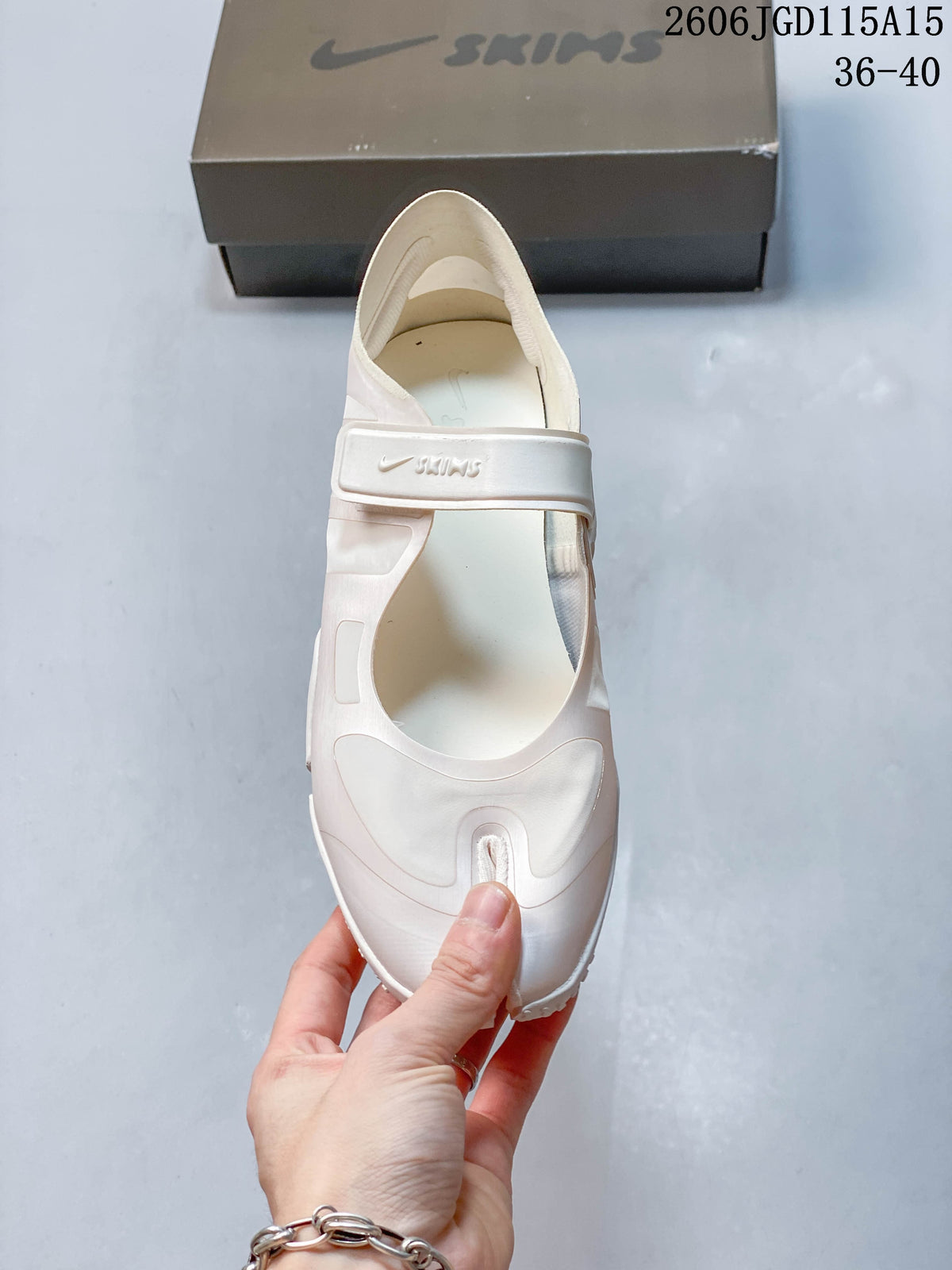 Top view of a Nike Air Rift shoe with an adjustable strap and split toe