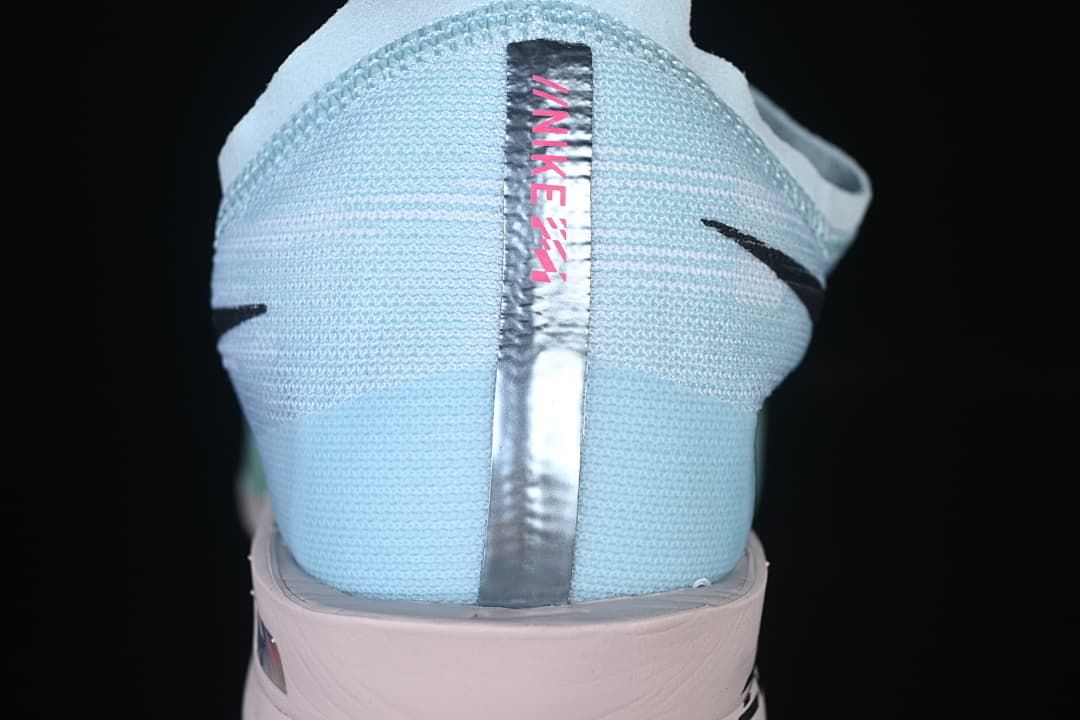 Rear view showing the pale blue heel and reflective center detail