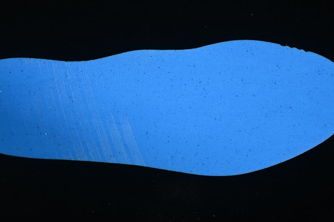 Blue shoe-shaped insert shown against a dark background