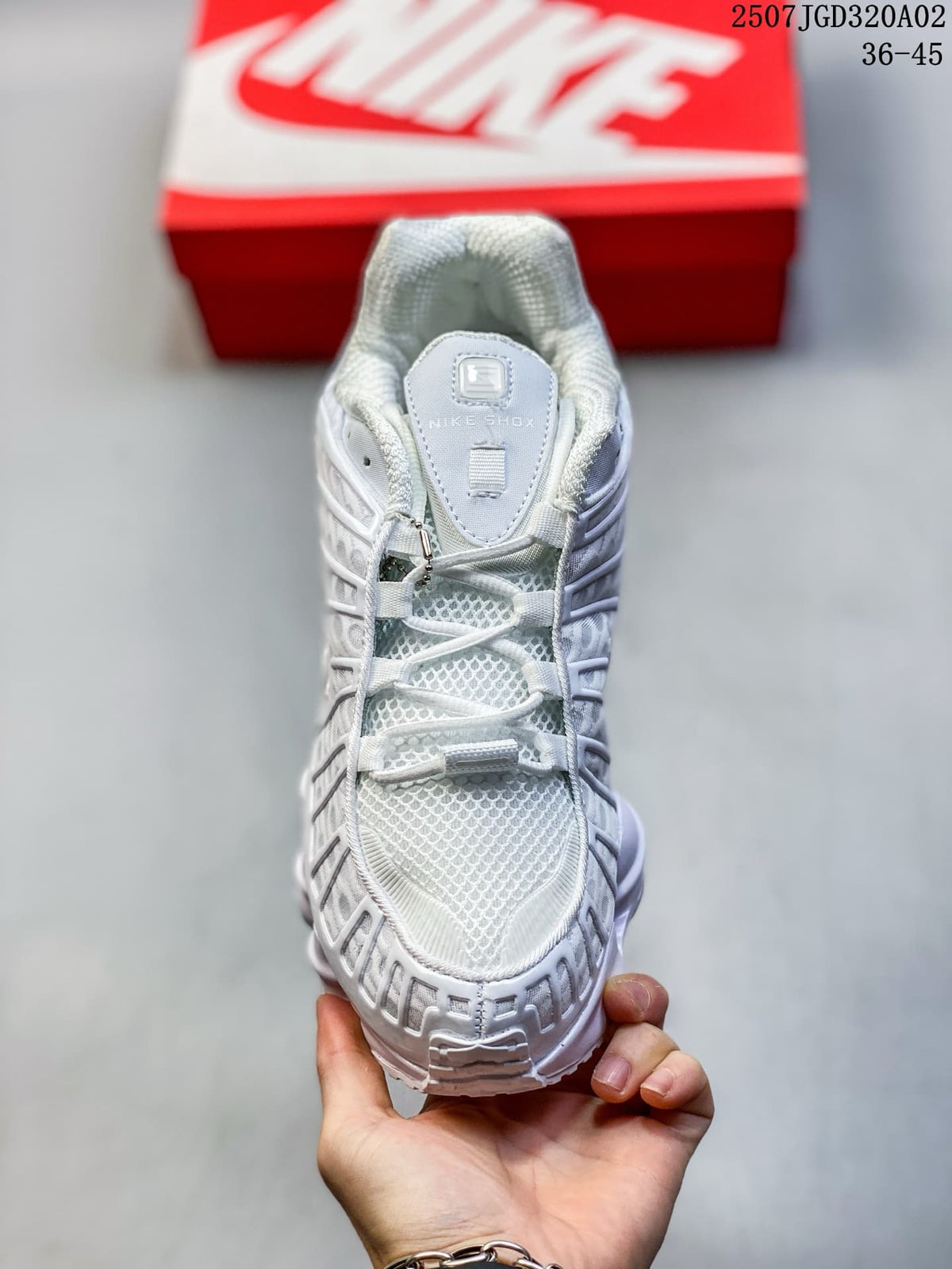 Top view of the white sneaker showing the laces and mesh-look upper