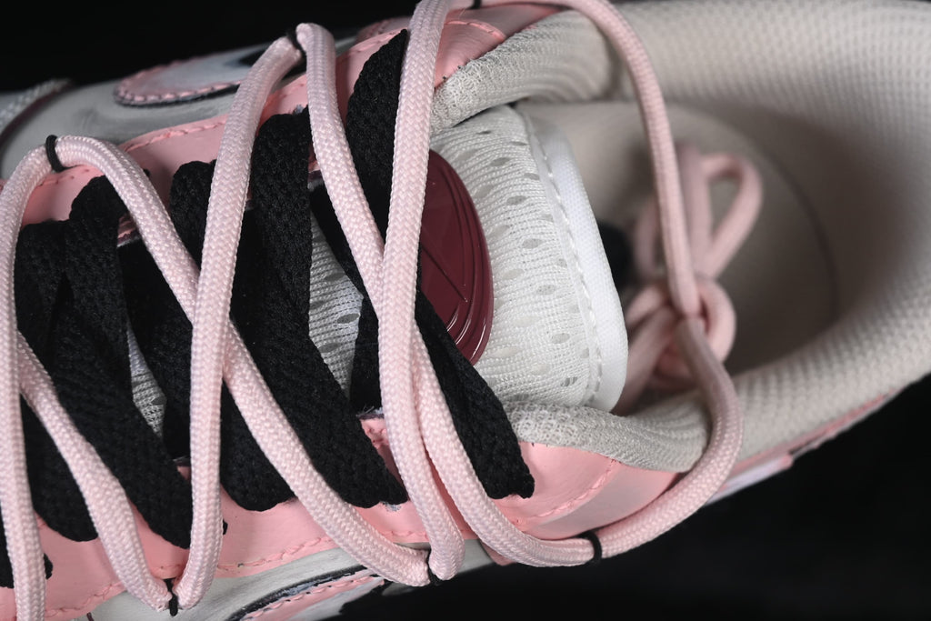 Close-up of pink and black laces over the tongue