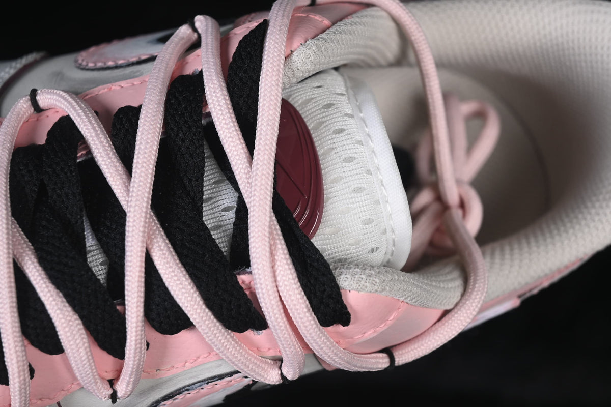 Close-up of pink and black laces over the tongue