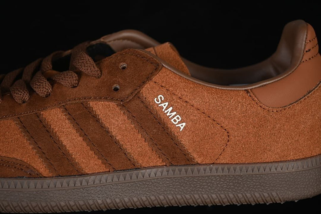 Close-up of brown upper, side stripes, laces, and Samba lettering