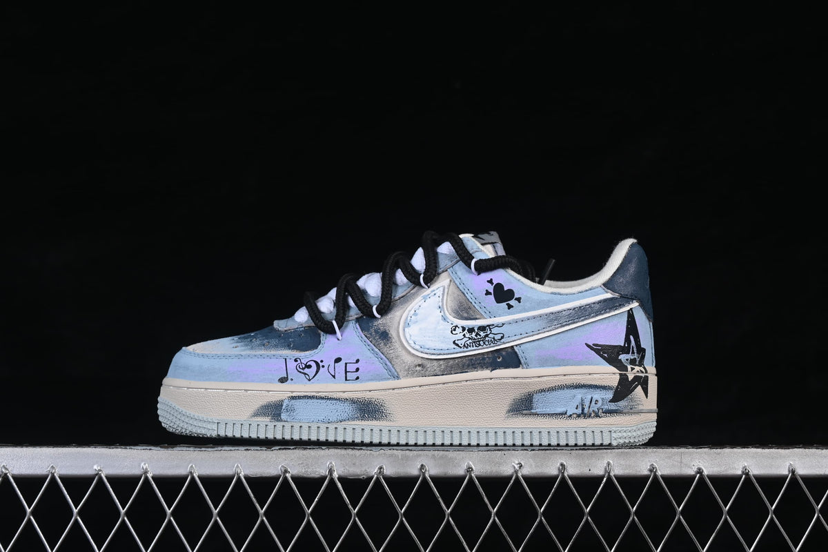 Side view of the sneaker with decorative lettering, heart and star graphics
