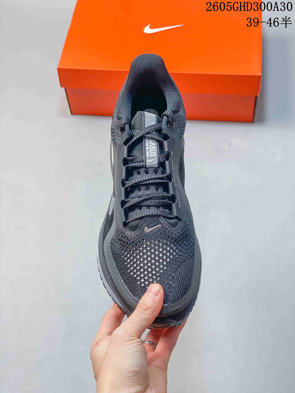 Top view of the charcoal running shoe showing its laces and textured toe.