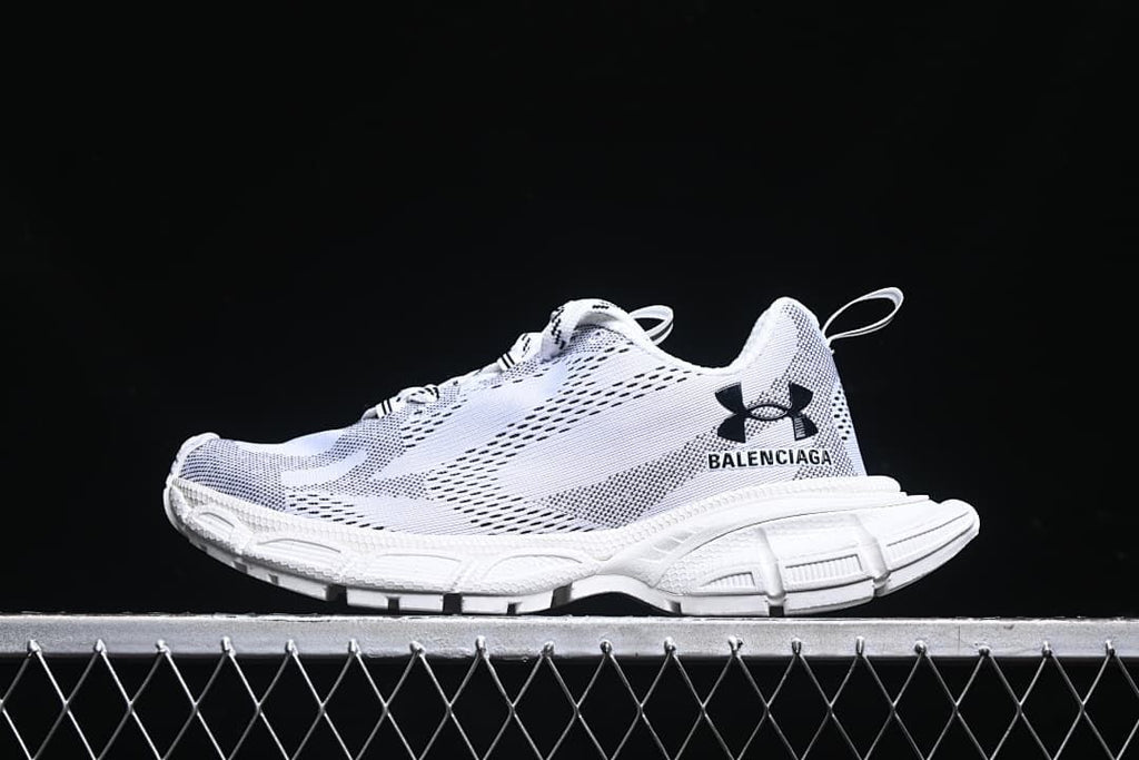 Side view of white and black Balenciaga 3XL low-top sneakers with a chunky sole.