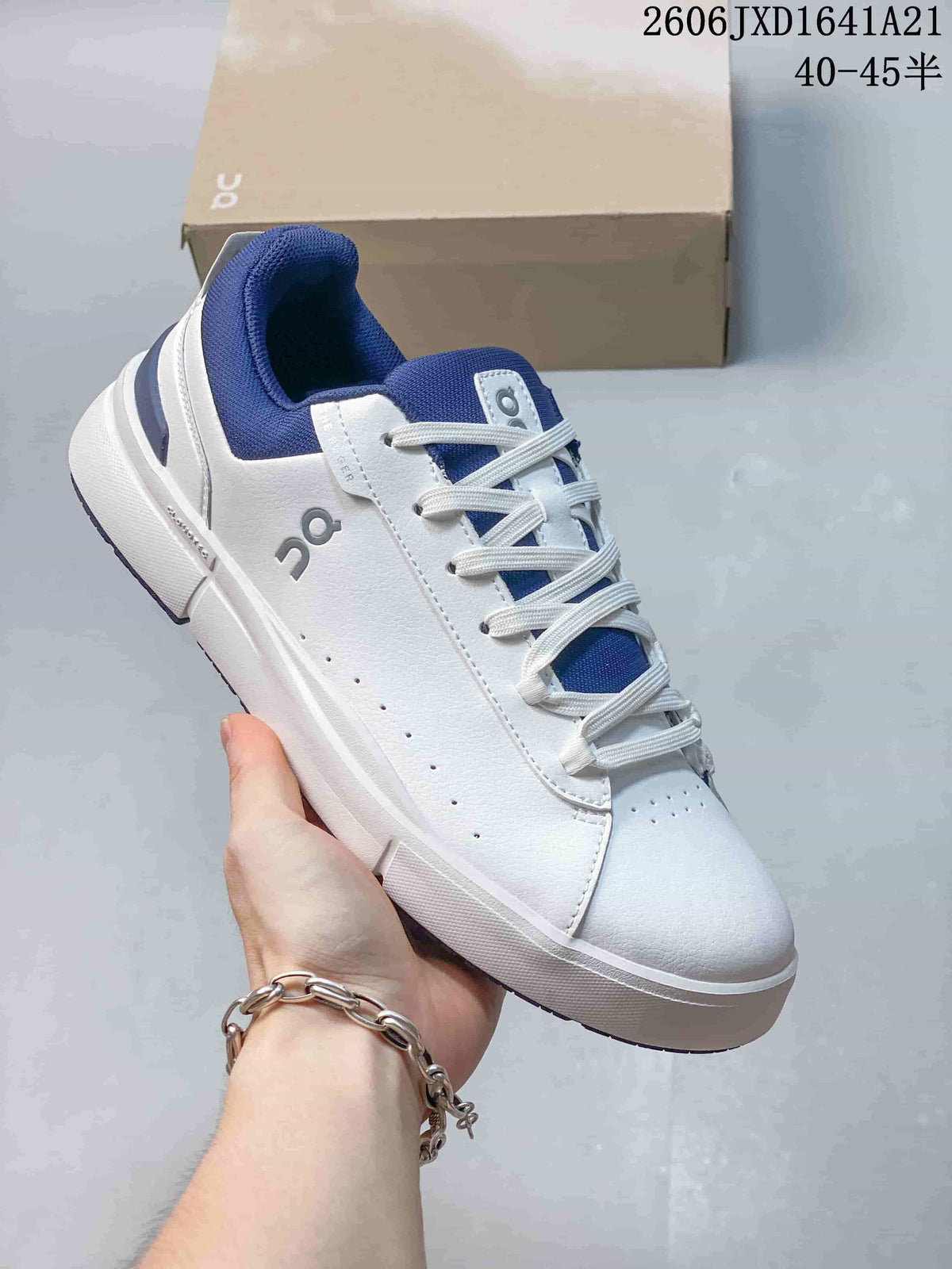White On The Roger low-top sneaker with royal blue collar and heel accents