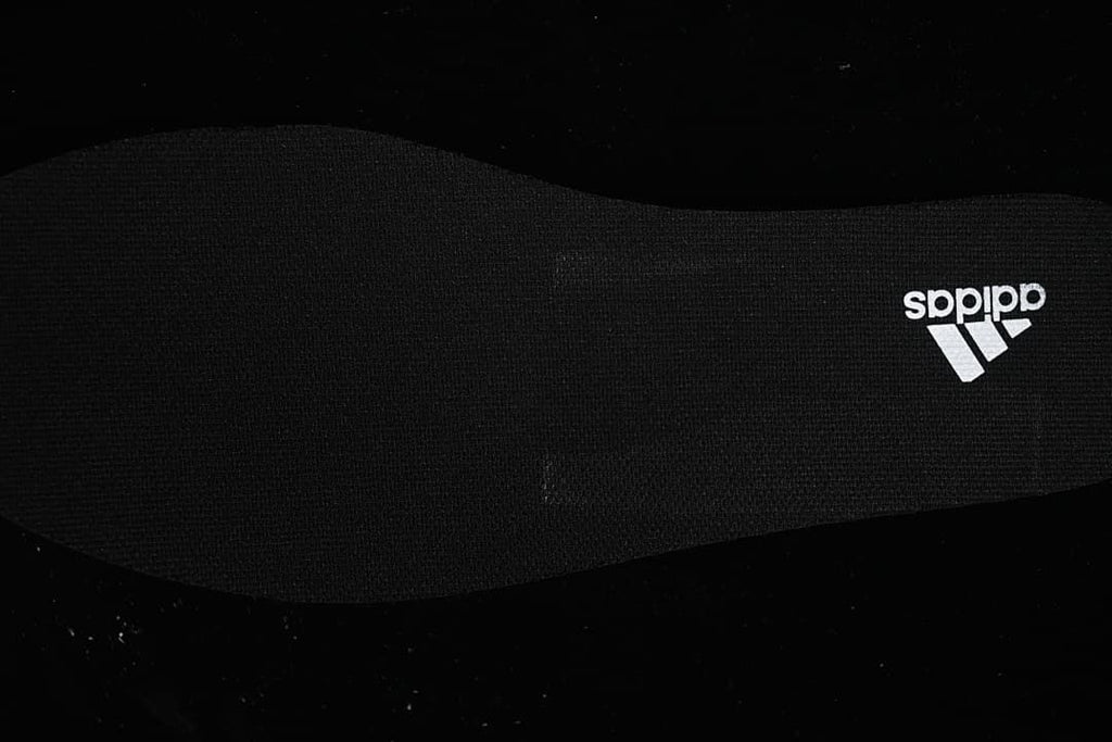 Close-up of the black insole with adidas branding