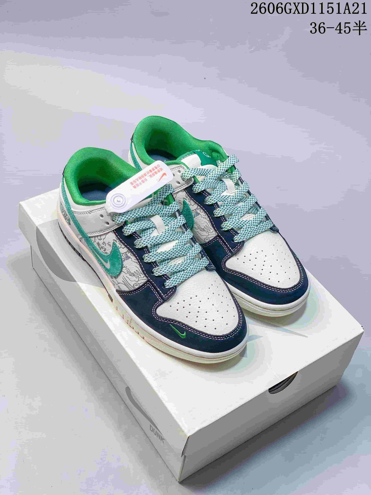 Pair of white, navy, and green low-top sneakers with patterned panels, shown on a box