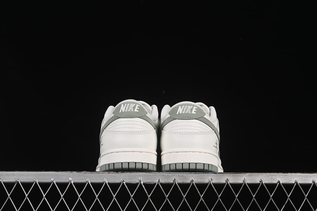 Rear view of both shoes showing grey-green heel details
