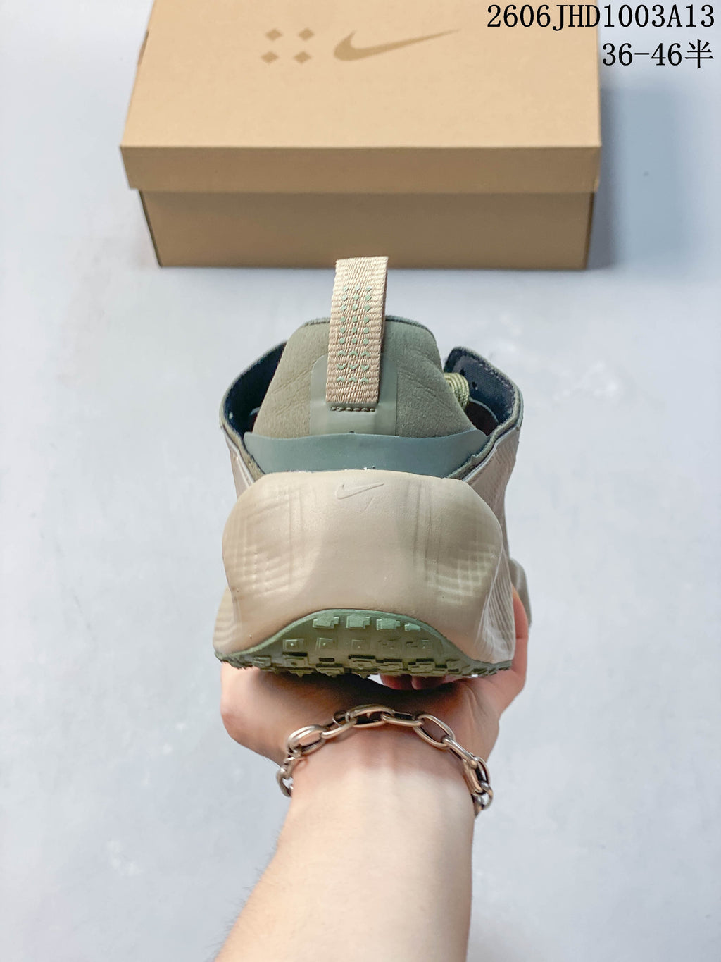 Rear view of a Nike Ava Rover sneaker with a sculpted light-colored heel