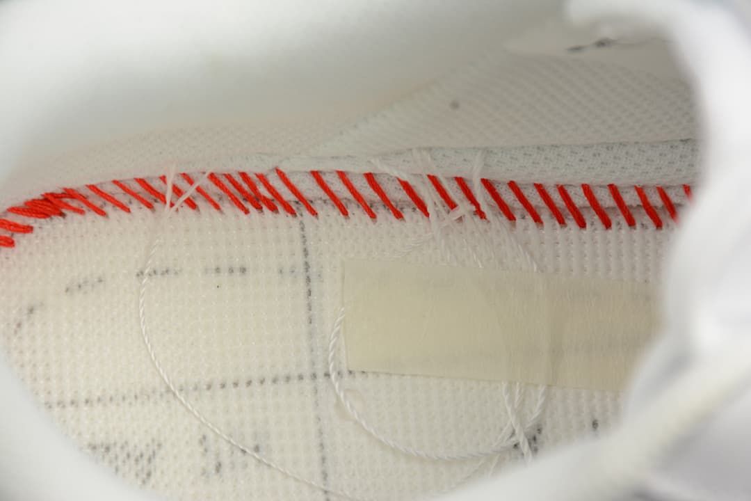 Close-up of interior stitching and lining inside the shoe.