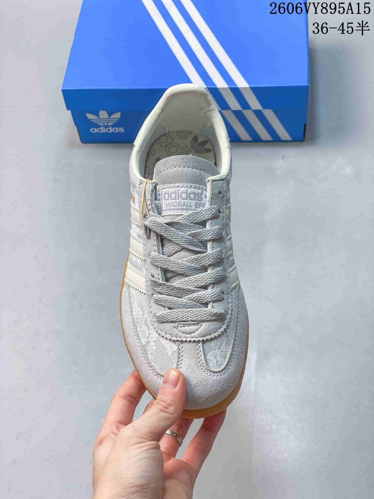 Top view of the lace-up sneaker with patterned panels and tongue label