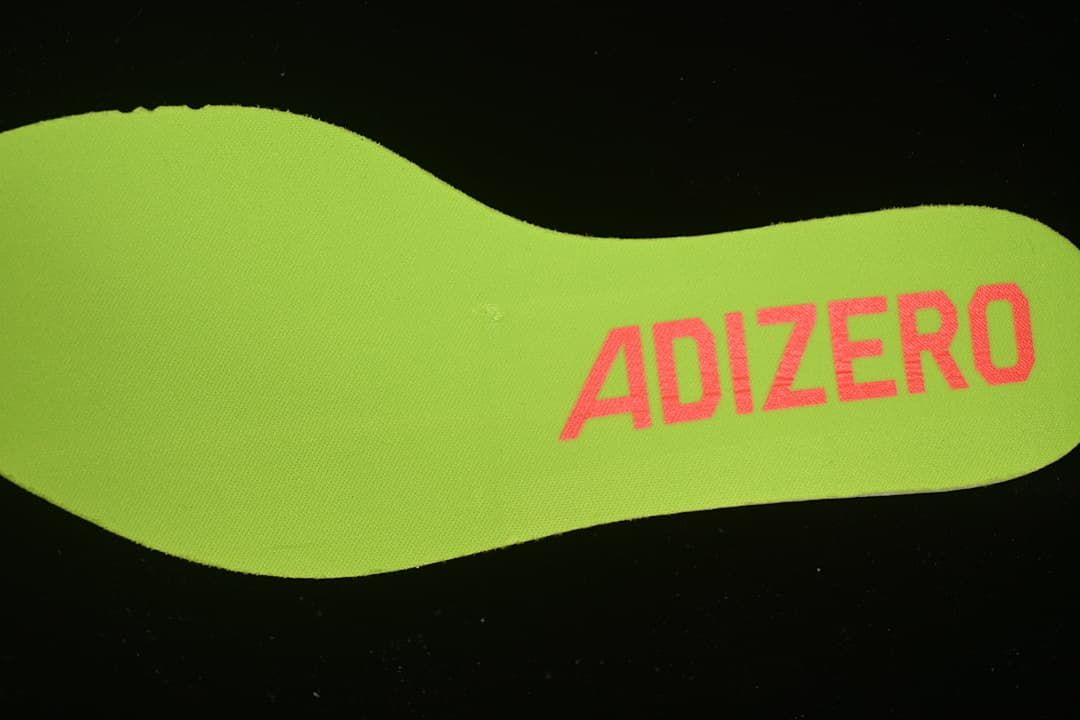 Lime-colored insole with Adizero lettering